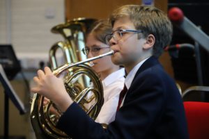 Musical Activities, Boy playing french horn