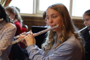 Sixth Form girl playing flute