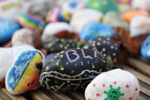 Painted stones with uplifting messages on them