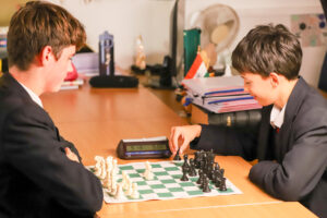 Two boys playing chess